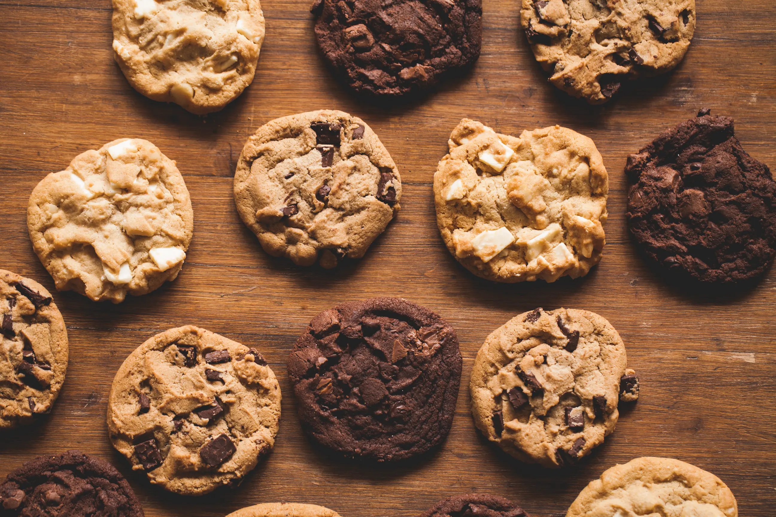 Assortment of homemade Treats by Kim cookies on a wooden table